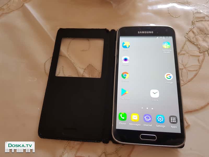 Сотовый телефон Самсунг на галакси s5. Работает без проблем и