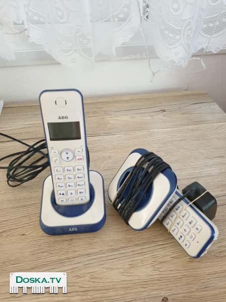 2 телефона в комплекте беспроводные. Цвет белый с синим. Полностью